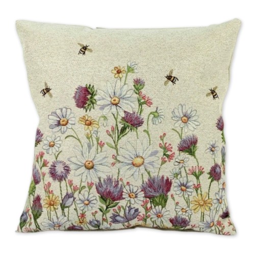 Kwadratowa poszewka gobelinowa z tkanym wzorem białych rumianków o żółtych środkach na jasnym, neutralnym tle.